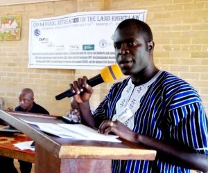 dr emmanuel urey chief of party landesa making remarks on behalf of his organization