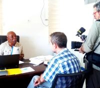 lla executive director stanley n toe being interviewed on the land rights act by a swiss television crew